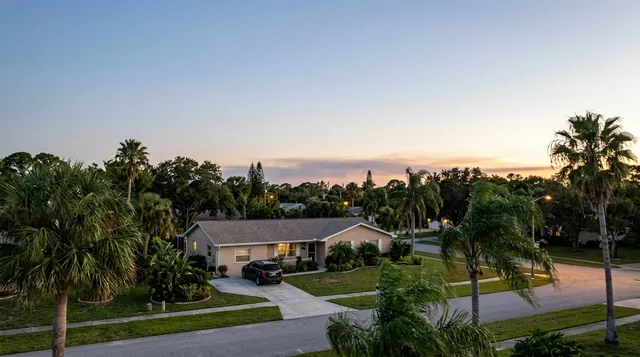 Hazy evening sky over a Palm Bay neighborhood showing the need for fire and smoke testing in Palm Bay homes.